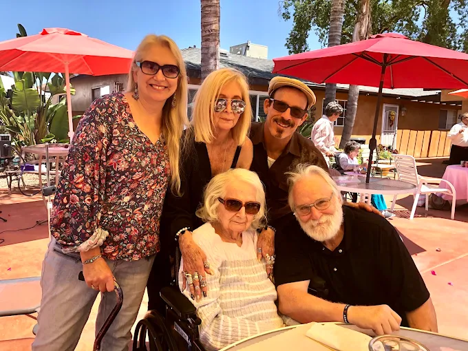 happy family visiting elder senior mother in assisted living center in visalia, ca